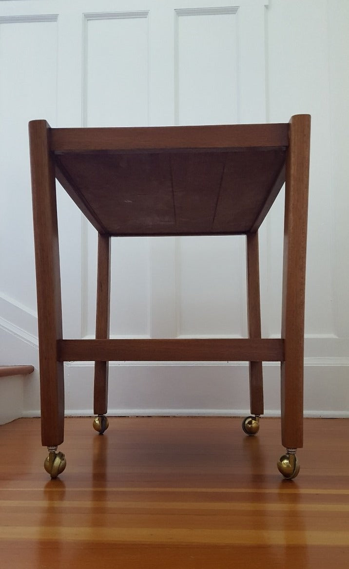 View of bottom of vintage mahogany bar cart- Cook Street Vintage