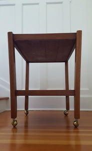 View of bottom of vintage mahogany bar cart- Cook Street Vintage