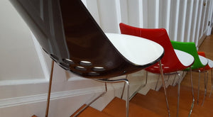 Black, red, green and orange Calligaris Jam Chairs on stairs- Cook Street Vntage