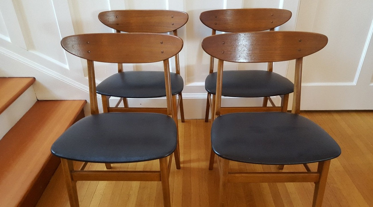 Four oval back dining chairs with black vinyl seat- Cook Street Vintage