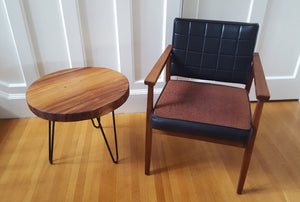 Teak Arm chair with black vinyl and brown upholstery with round teak side table with metal hairpin legs- Cook Street Vintage