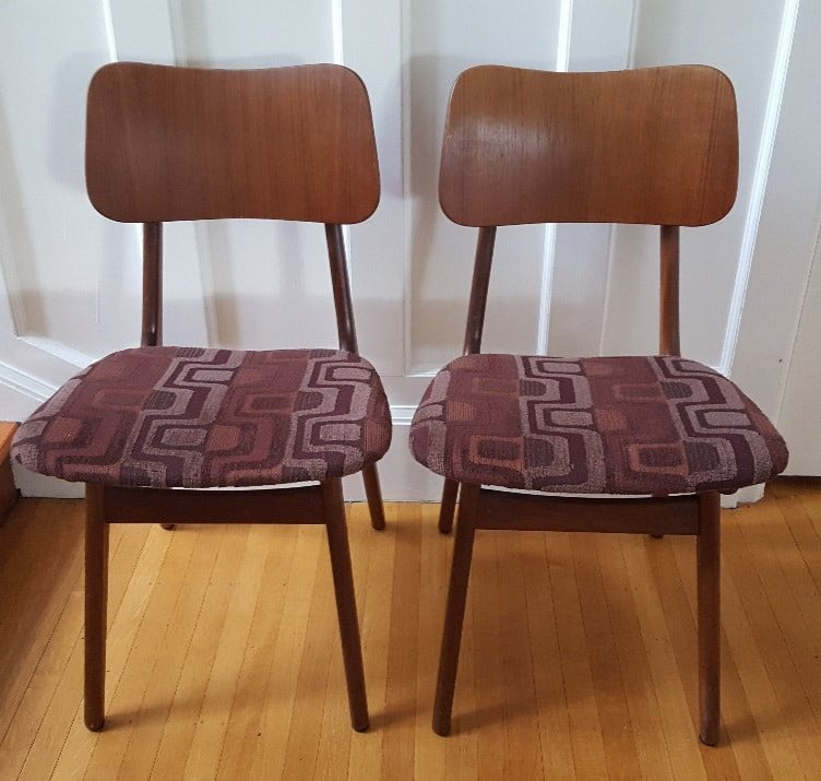 Midcentury teak Danish chairs with brown geometric design upholstered seats.- Cook Street Vintage
