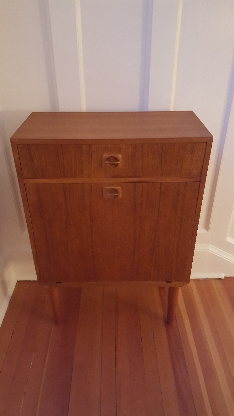 Retro Vintage Teak Cocktail Bar Cabinet features a mirror, glass shelf, and drawer space- Cook Street Vintage