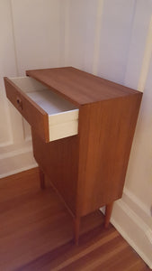 Retro Vintage Teak Cocktail Bar Cabinet features a mirror, glass shelf, and drawer space- Cook Street Vintage
