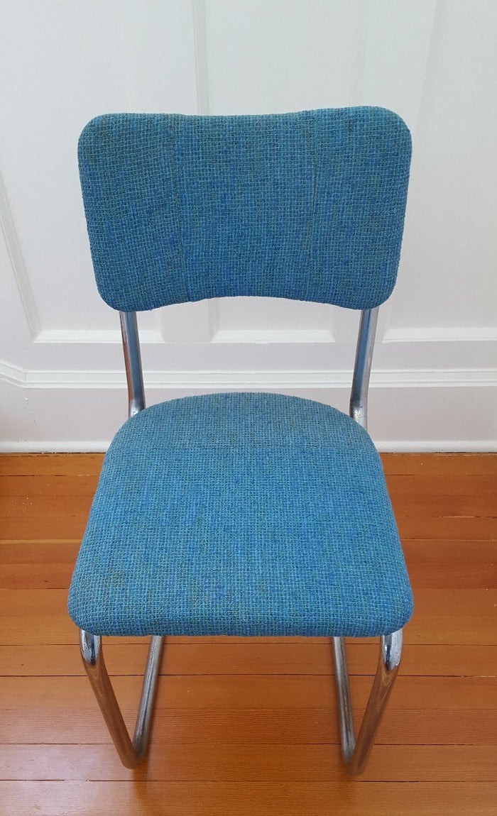 Vintage cantilevered armless chrome chair with blue upholstery. Made in USA by Howell- Cook Street Vintage