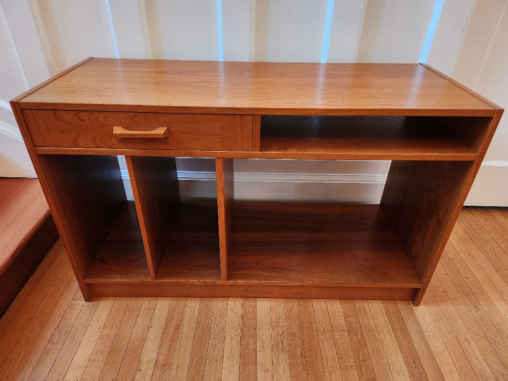 Great entertainment storage unit for your TV or turntable. One drawer for remotes, vertical shelves for LPs or books.- Cook Street Vintage