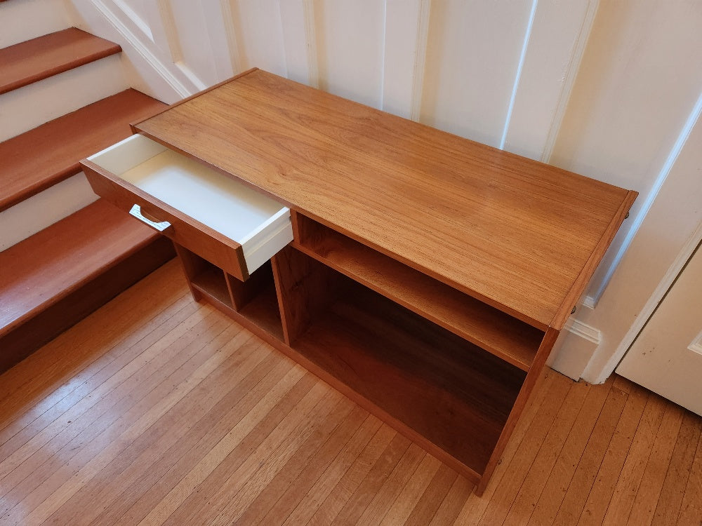 Great entertainment storage unit for your TV or turntable. One drawer for remotes, vertical shelves for LPs or books.- Cook Street Vintage