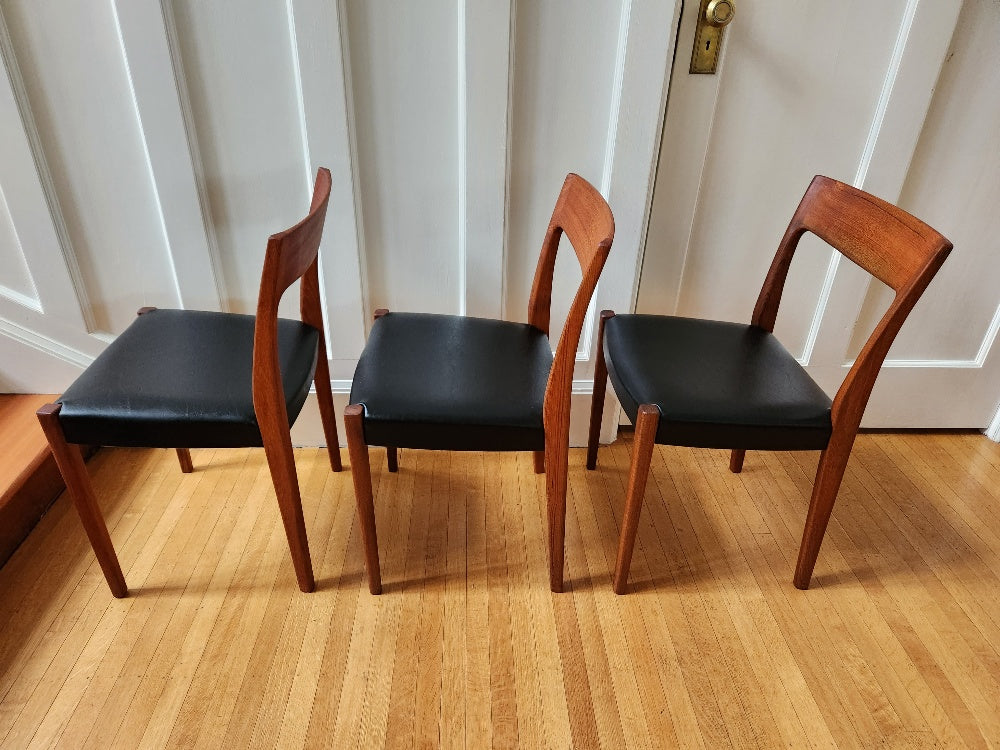 Side view of Gorgeous MCM teak dining chairs with new black vinyl seats. Made in Sweden by Svegards Markaryd- Cook Street Vintage