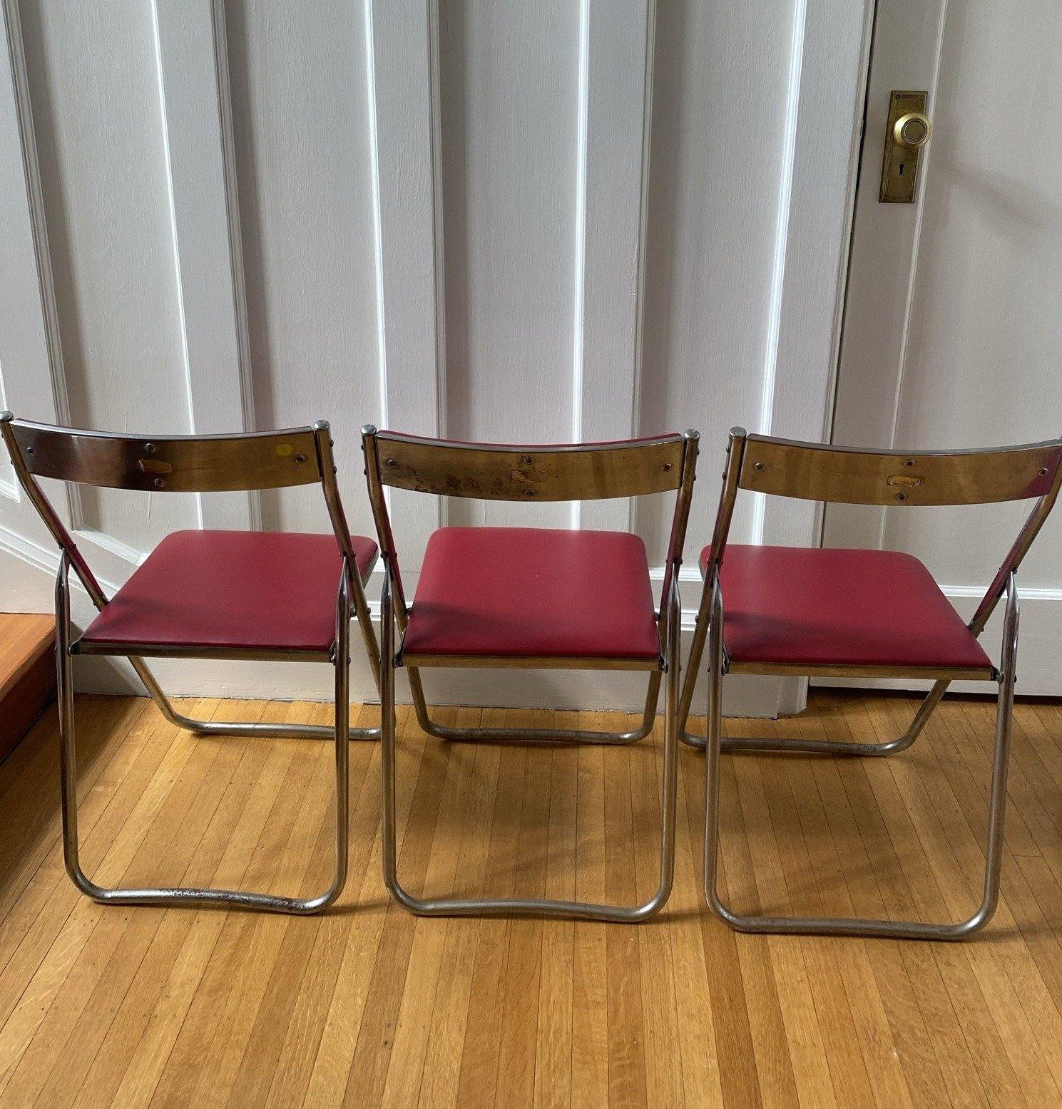 Back view of 3 red vinyl and chrome folding chairs- Cook Street Vintage