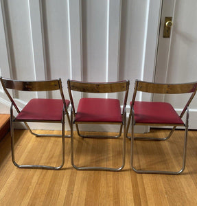 Back view of 3 red vinyl and chrome folding chairs- Cook Street Vintage