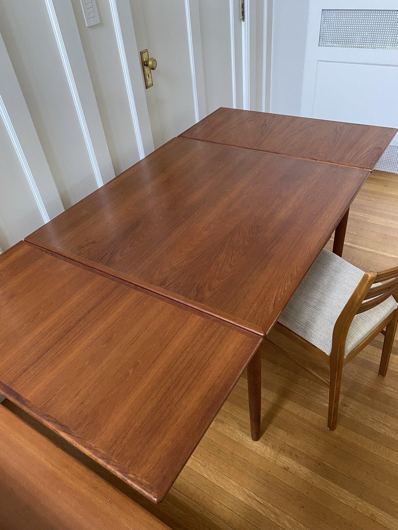 Danish Mid-Century teak extending dining table by Henning Kjaernulf with two hidden draw leaves extended- Cook Street Vintage