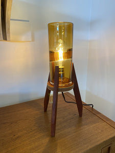 Reclaimed teak tripod lamp with amber shade on teak credenza- Cook Street Vintage