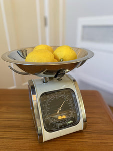 Top view of cream and chrome kitchen scale with three lemons-Cook Street Vintage