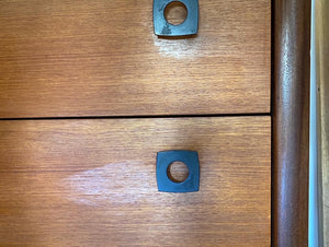 Detail of black metal brutalist ahrdware on Gorgeous RS and Associates five drawer teak and rosewood dresser with black vinyl covered base- Cook Street Vintage