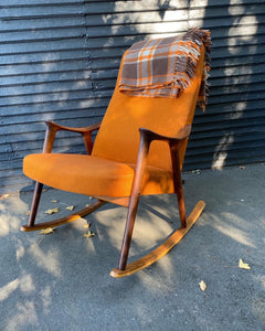 Beautiful tartan wool car blanket by Ayers in pumpkin orange and brown plaid on Westnofa teak rocking chair-Cook Street Vintage