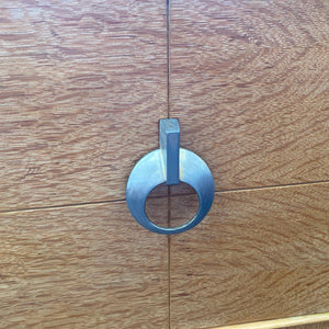 Close up of door pull to MCM 1952 Fleetwood Stereo Cabinet bar- Cook Street Vintage