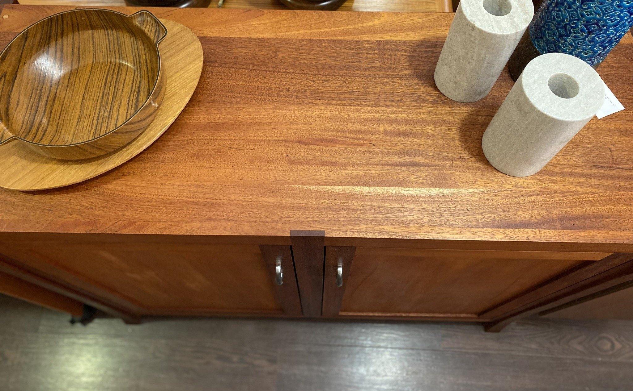 Birds eye view of wood bar and storage unit with vases and two wood bowls- Cook Street Vintage