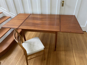 Danish Mid-Century teak extending dining table by Henning Kjaernulf with two hidden draw leaves fully  extended- Cook Street Vintage
