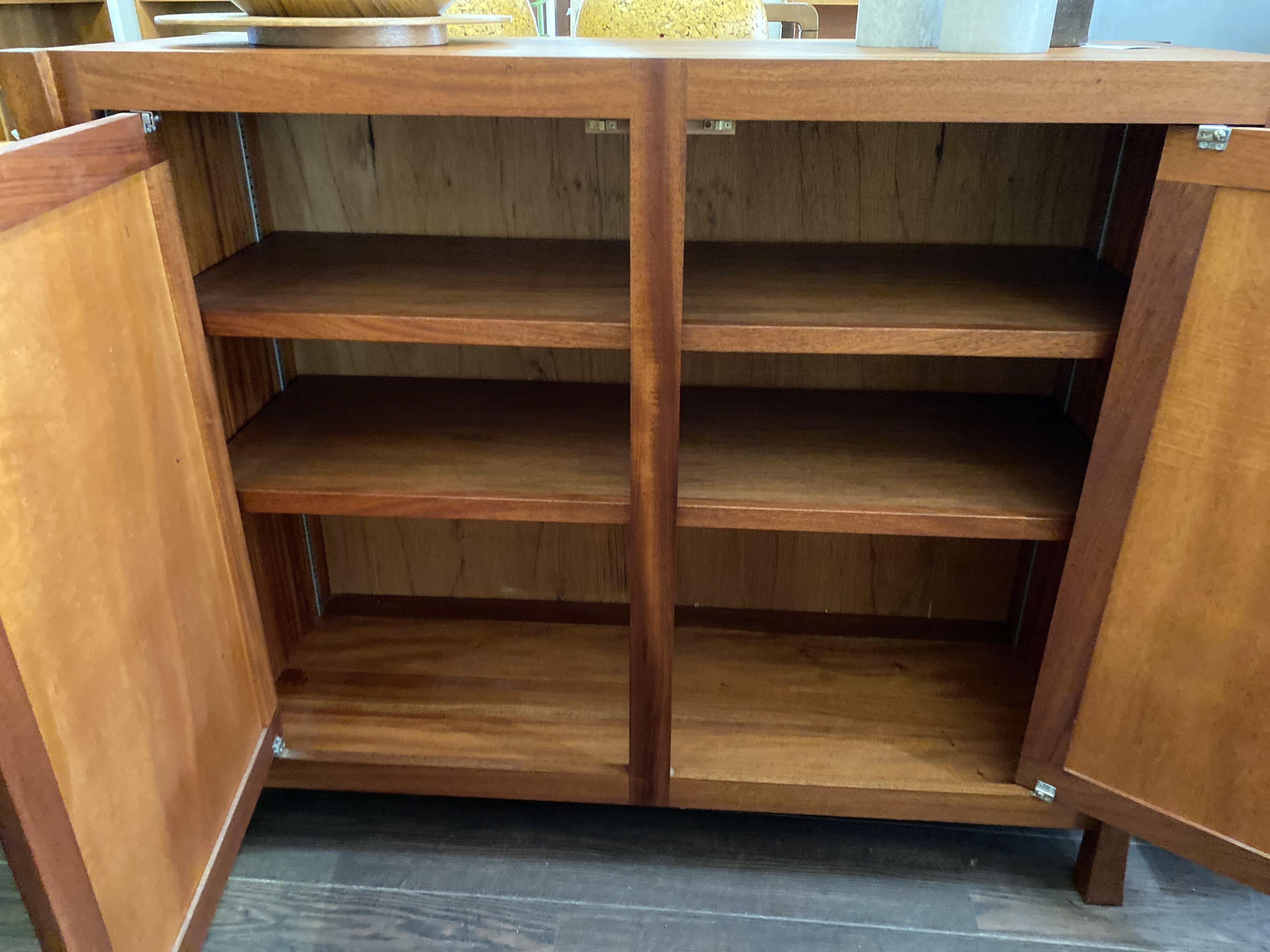 Interior view of two adjustable shelves in teak bar storage cabinet- Cook Street Vintage