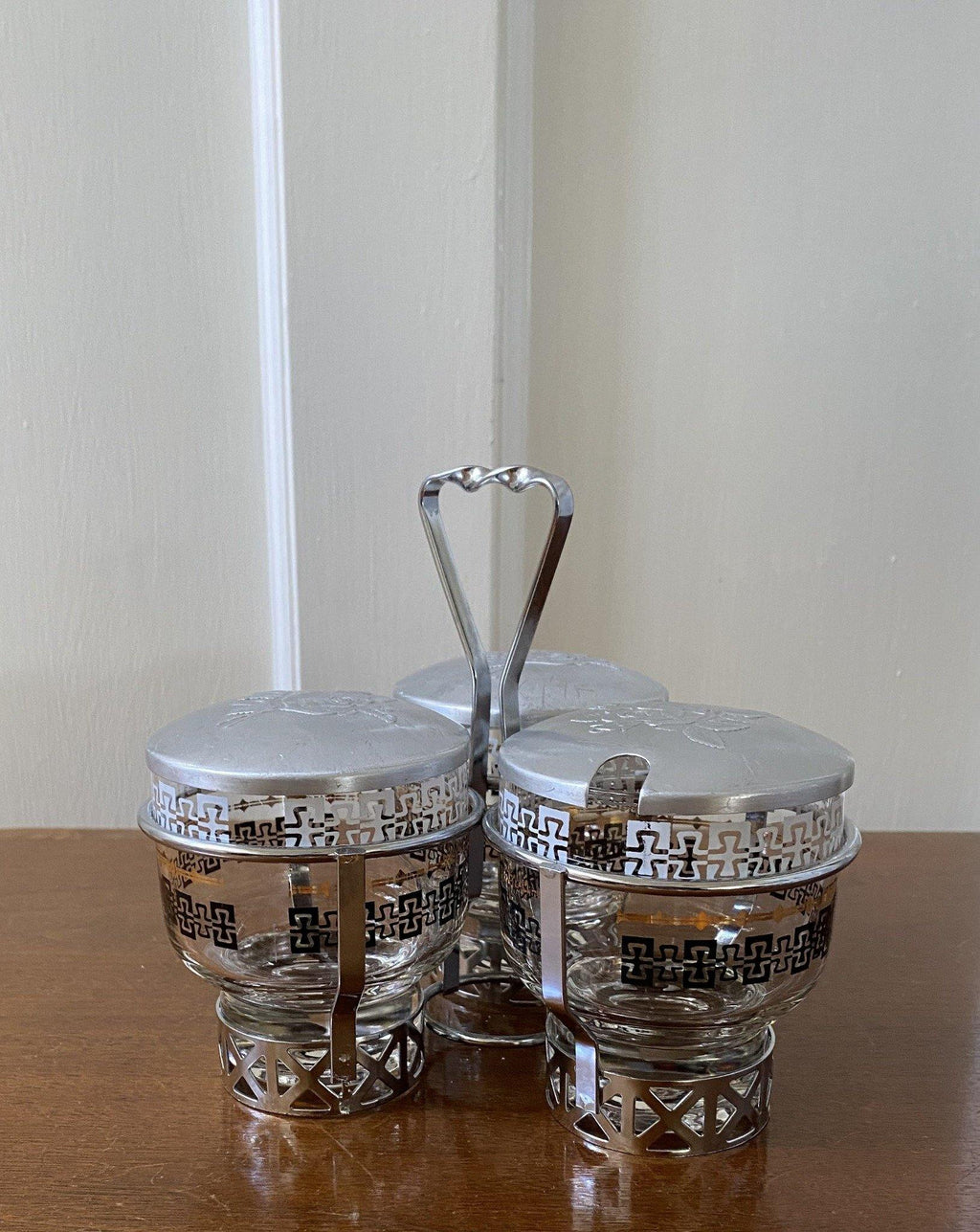 Glass condiment set with black and gold detail in metal holder- Cook Street Vintage
