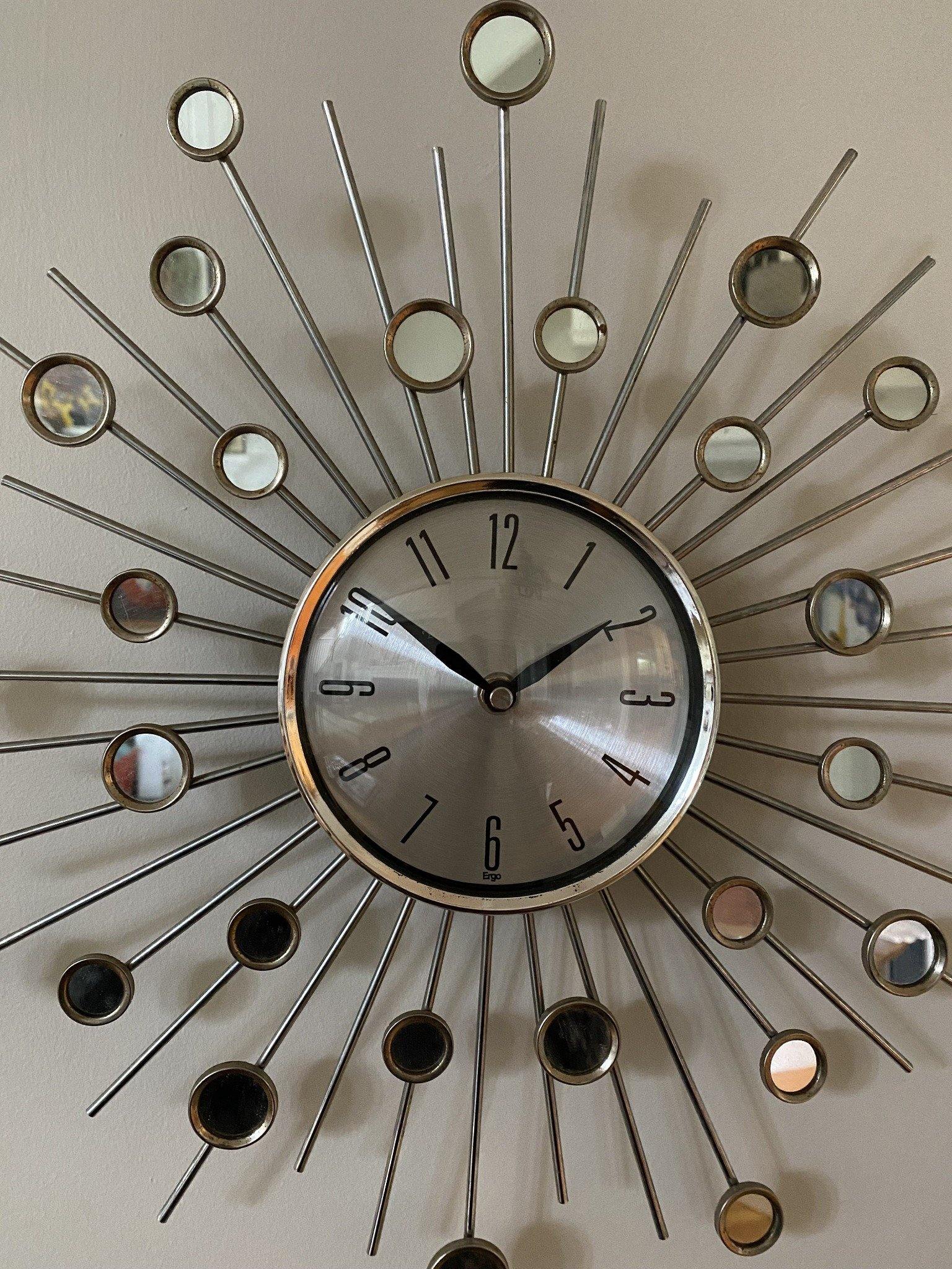 Close up of wall clock with mirrors and pointed detail- Cook Street Vintage