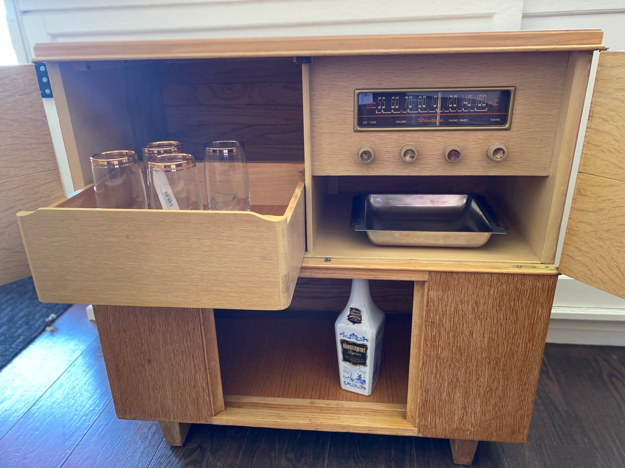Open cabinet and drawer with glasses and tray of 1950s refurbished Fleetwood Stereo Cabinet- Cook Street Vintage