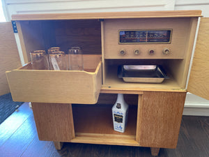 Open cabinet and drawer with glasses and tray of 1950s refurbished Fleetwood Stereo Cabinet- Cook Street Vintage