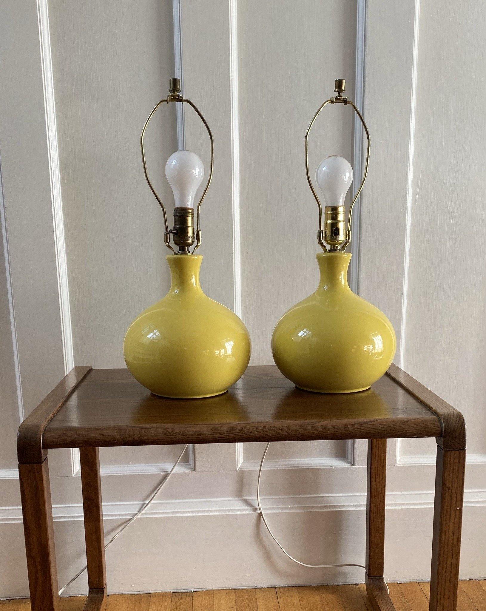 Pair of yellow ceramic table lamps on teak table- Cook Street Vintage