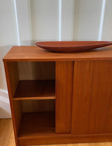 midcentury teak cabinet with left hand sliding door open with interior shelf- Cook Street Vintage