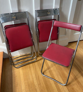 One open and 4 closed chrome and red vinyl vintage folding chairs- Cook Street Vintage