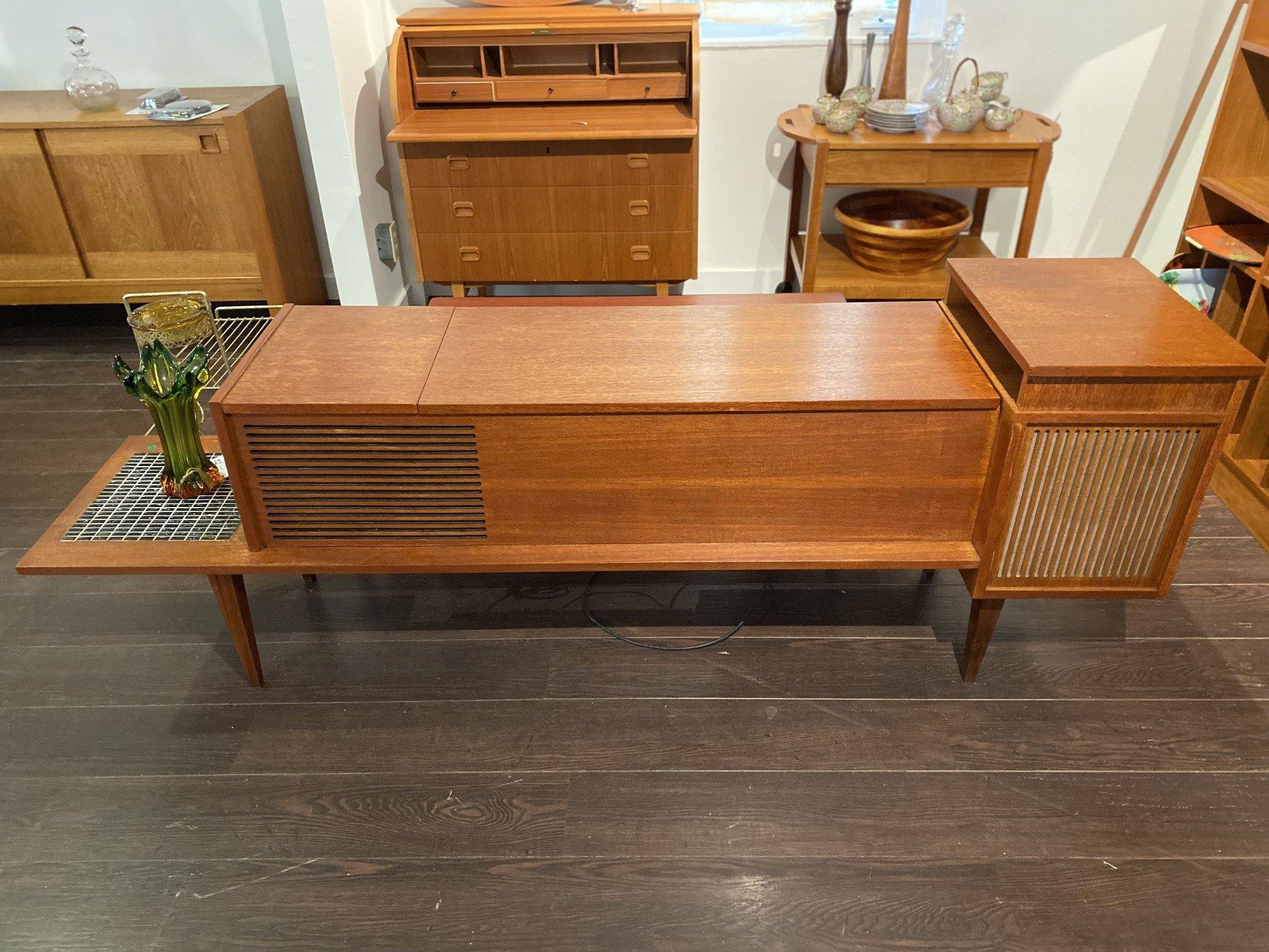 Front view of unique stereo console with green tulip vase- Cook Street Vintage
