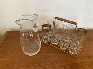 Top view of vintage glass pitcher iwth 8 clear and gold glasses in carrier- Cook Street Vintage