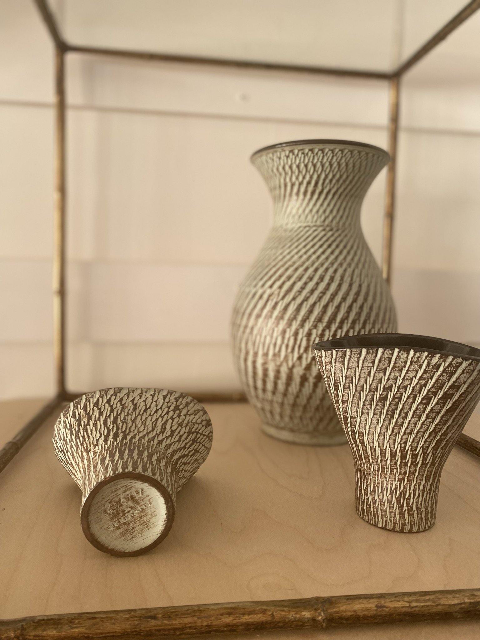 3 MCM German ceramic vases on table, one smaller one leaning on its side- Cook Street Vintage
