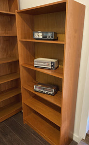 Side view of teak shelves with vintage radios- Cook Street Vintage