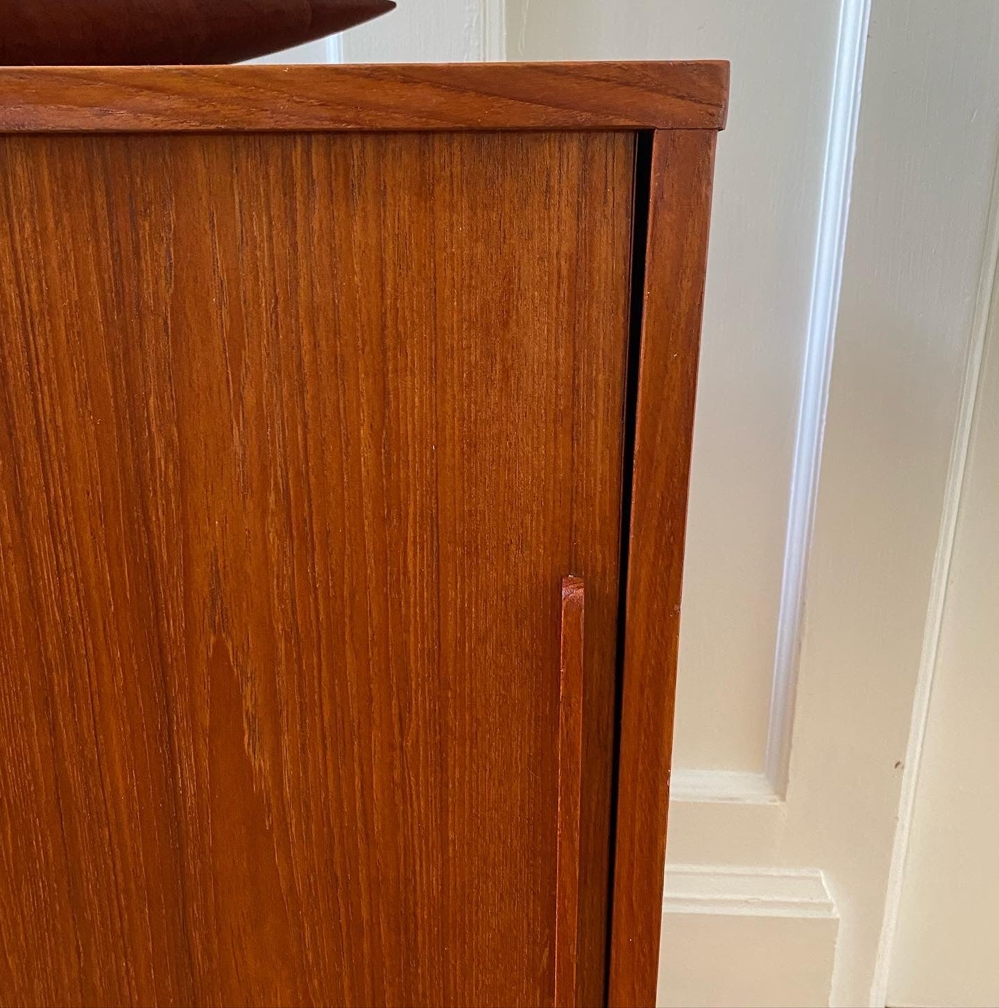 detail of sliding door of vintage teak cabinet- Cook Street Vintage