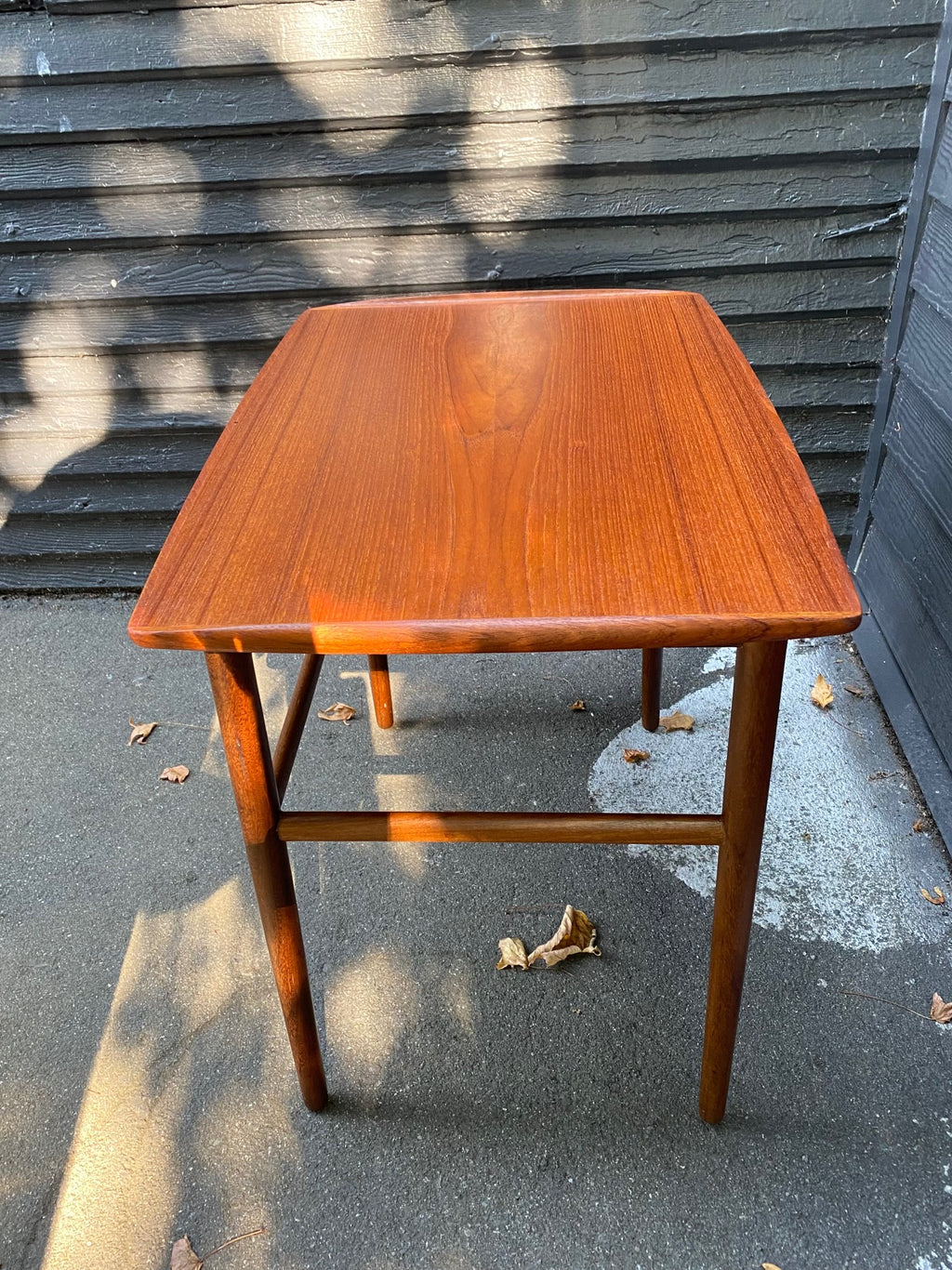 Gorgeous Scandinavian design teak side table with curved edge and elegant tapered leg- Cook Street Vintage