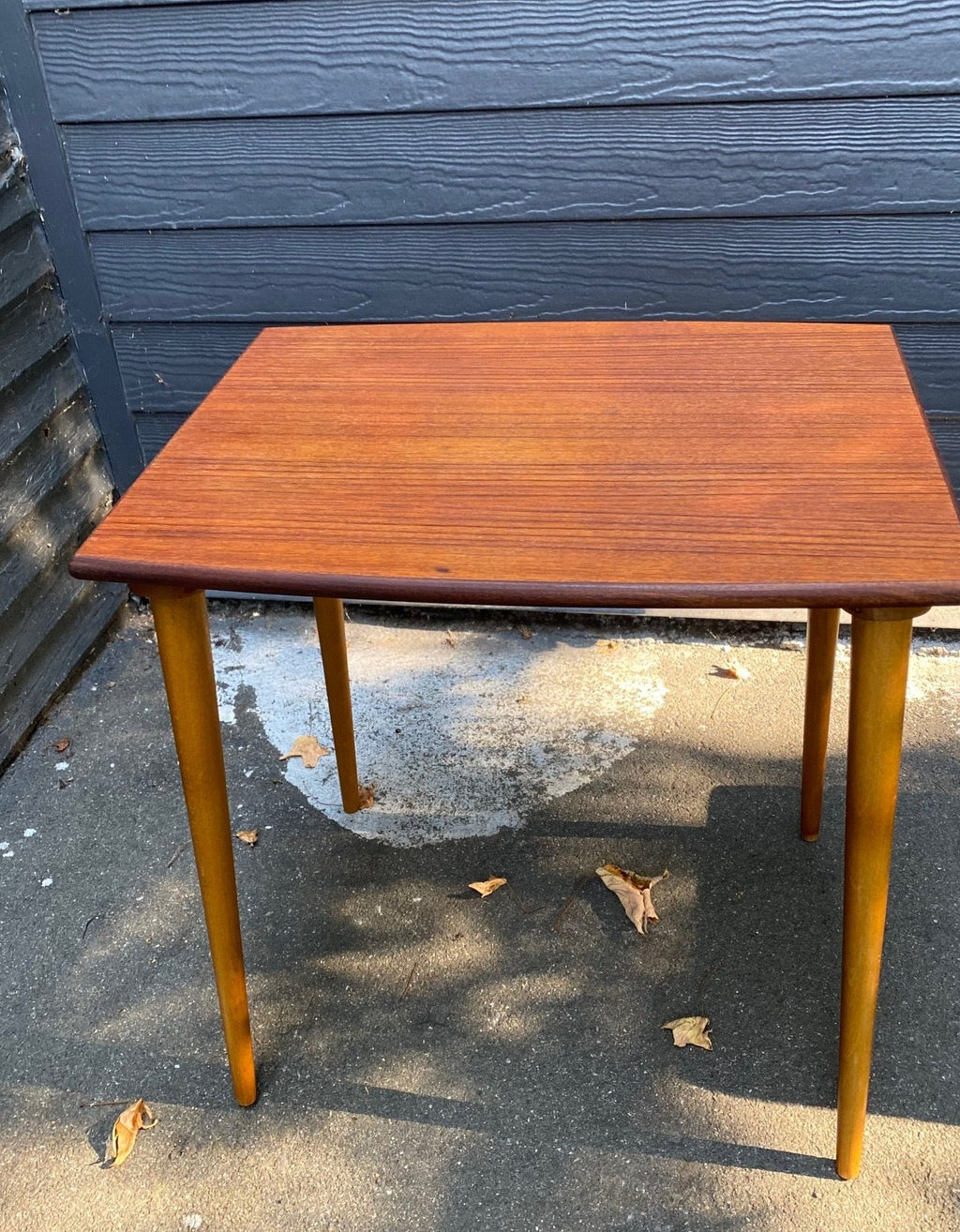 Gorgeous mid-century Scandinavian design teak side table with curved edge and elegant tapered legs- Cook Street Vintage