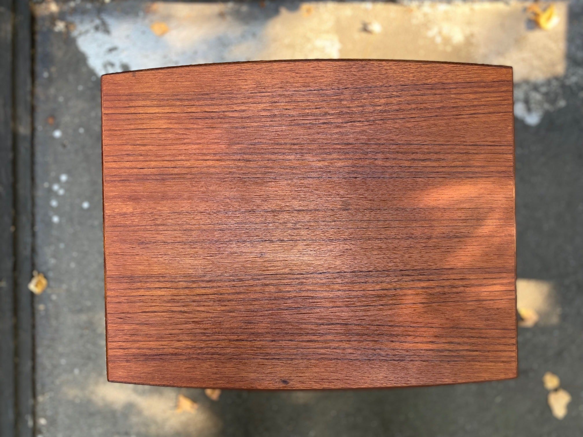 Gorgeous mid-century Scandinavian design teak side table with curved edge and elegant tapered legs- Cook Street Vintage