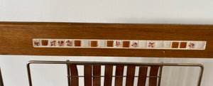 Detail of ceramic tile inlay of mid century teak basket weave magazine rack- Cook Street Vintage