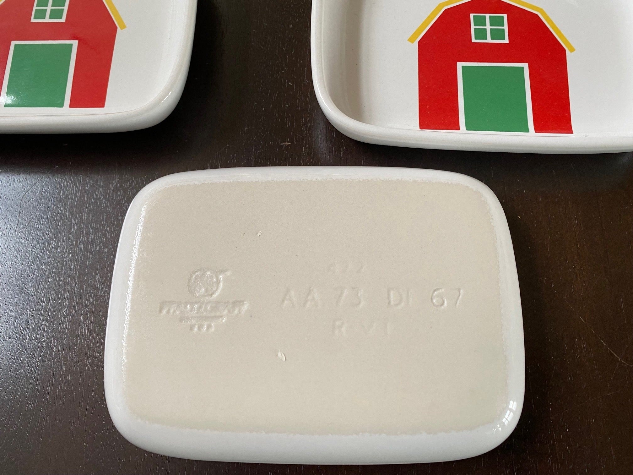 reverse side of Pfaltzgraff Children's Snack Plates/Dishes by Marimekko for American Airlines- with bright red house, yellow roof and green door Cook Street Vintage