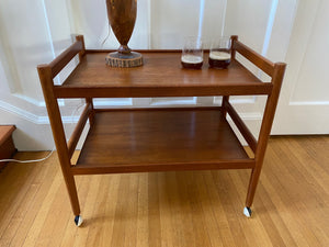 Lovely mid-century teak bar cart with original casters. Made in Denmark-Cook Street Vintage