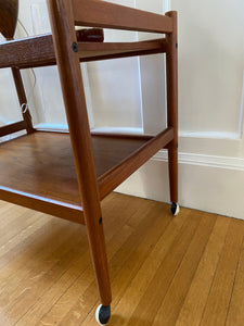 Lovely mid-century teak bar cart with original casters. Made in Denmark-Cook Street Vintage