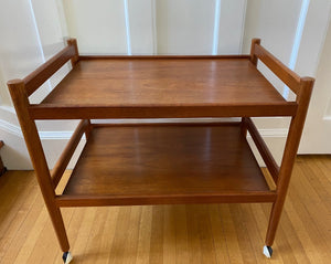 Lovely mid-century teak bar cart with original casters. Made in Denmark-Cook Street Vintage