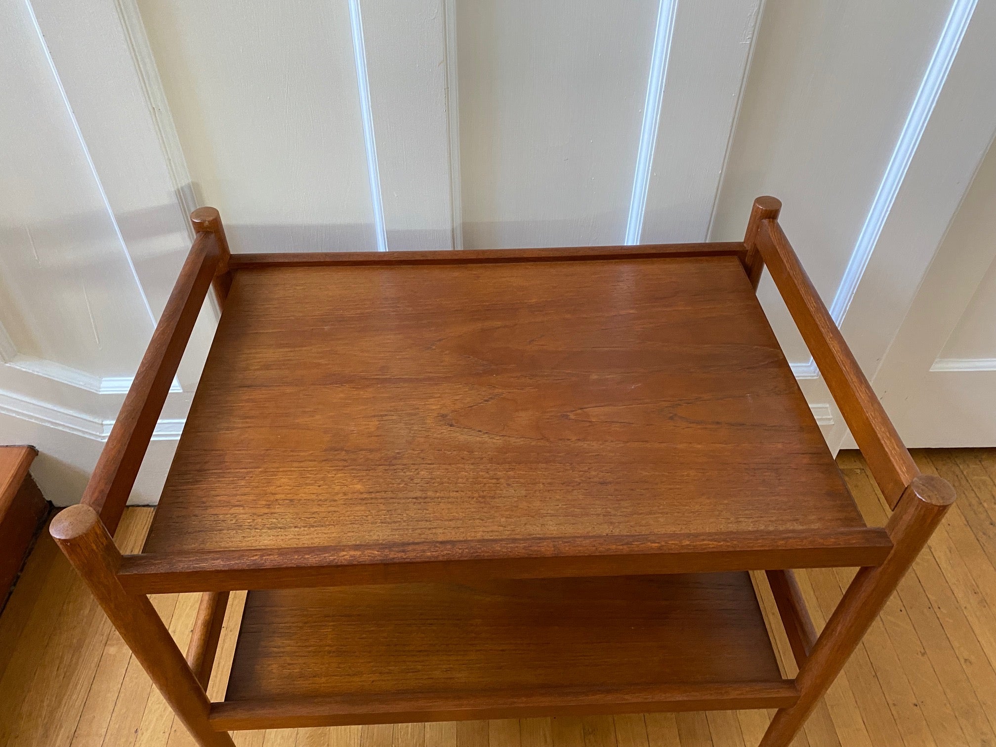 Lovely mid-century teak bar cart with original casters. Made in Denmark-Cook Street Vintage