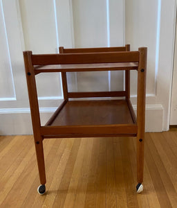 Lovely mid-century teak bar cart with original casters. Made in Denmark-Cook Street Vintage