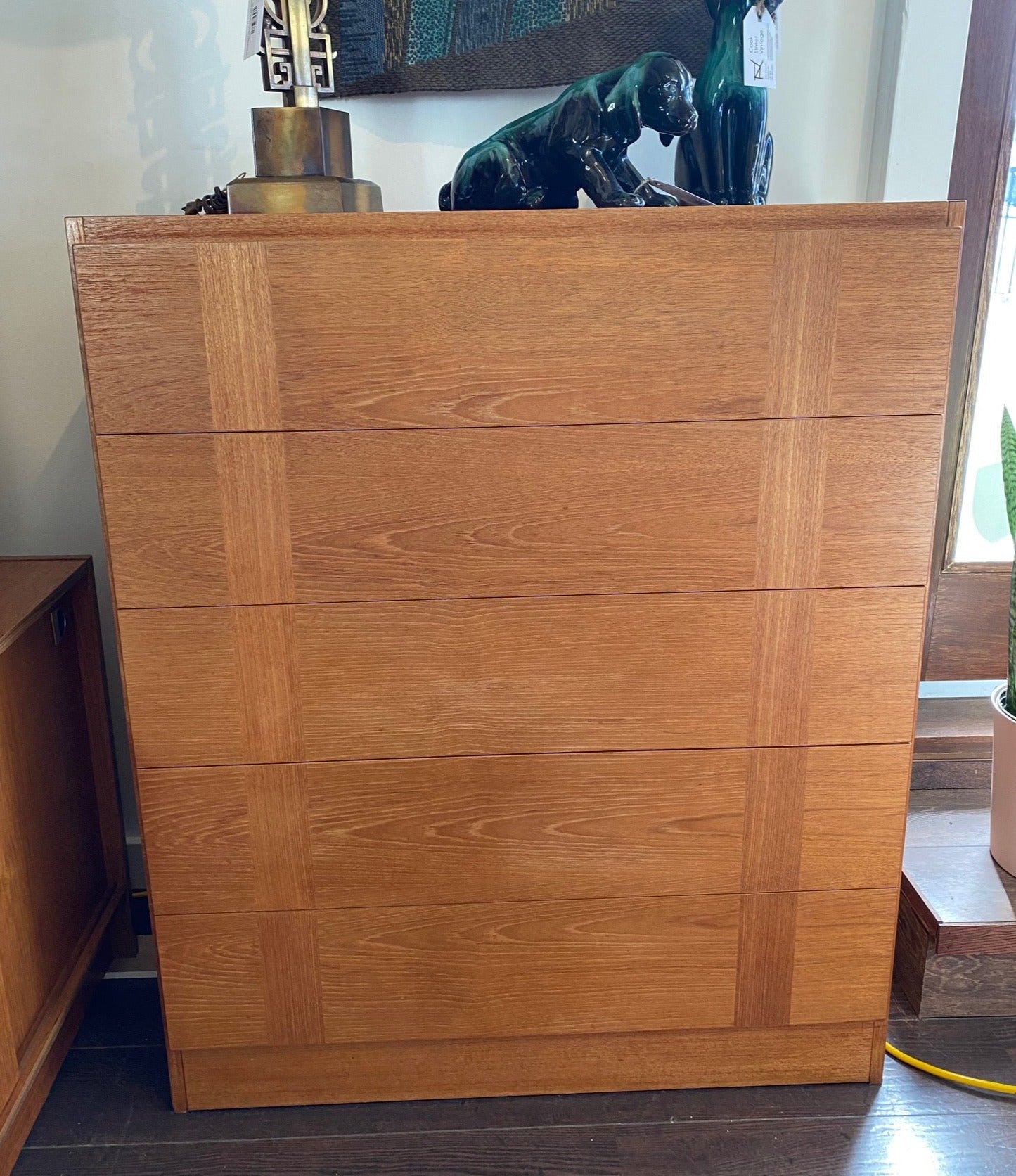 Gorgeous five drawer teak dresser with inset vertical cross grain detail. Side handles for easy opening and safety runners to prevent drawers from opening too far. Made in Canada by RS Associates- Cook Street Vintage