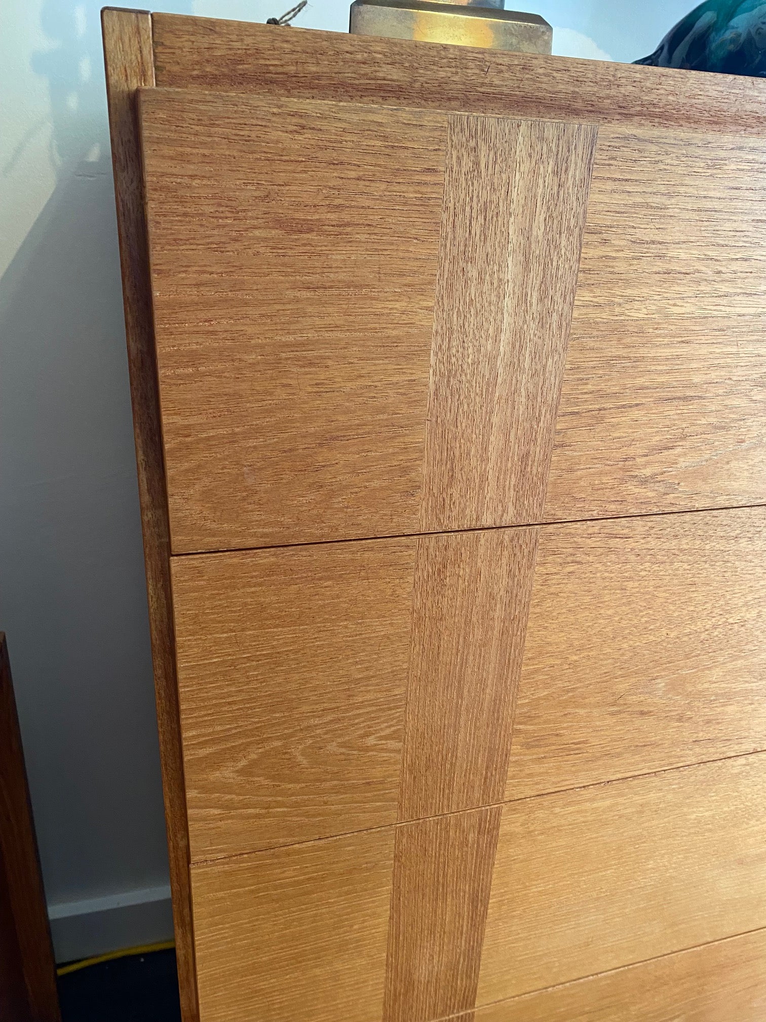 Gorgeous five drawer teak dresser with inset vertical cross grain detail. Side handles for easy opening and safety runners to prevent drawers from opening too far. Made in Canada by RS Associates- Cook Street Vintage