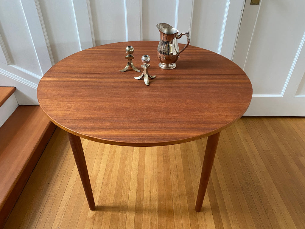 Round Midcentury Teak Dining Table with silver candlesticks and jug- Cook Street Vintage