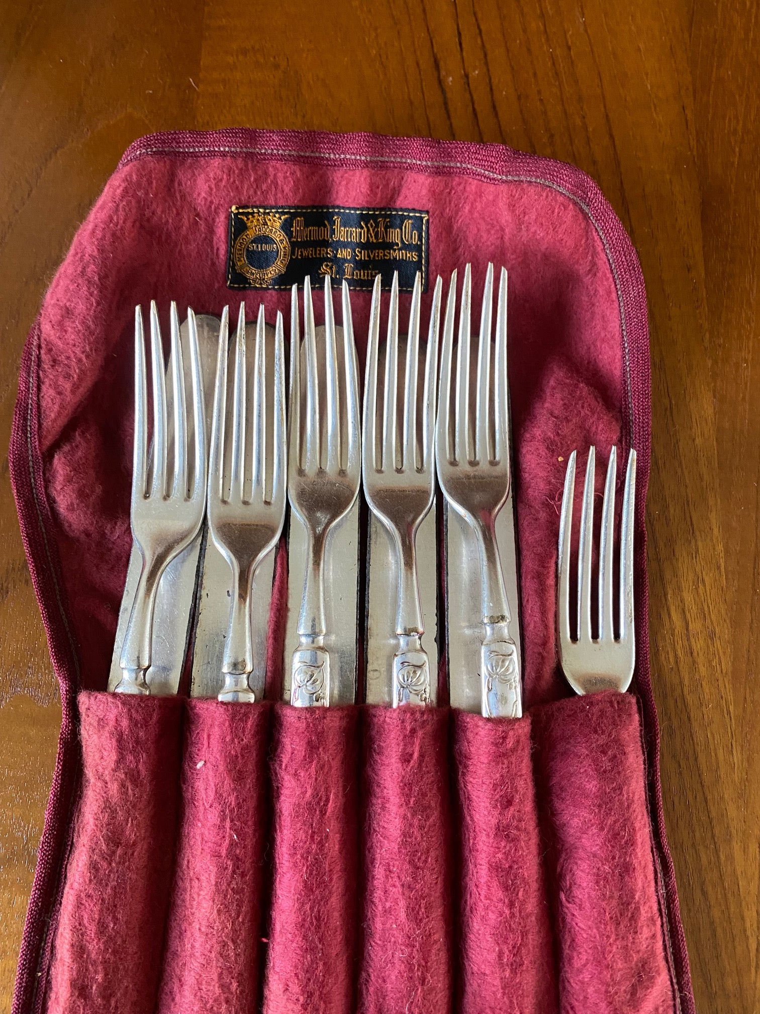 6 fors and 5 knives in red felt bag- Cook Street Vintage