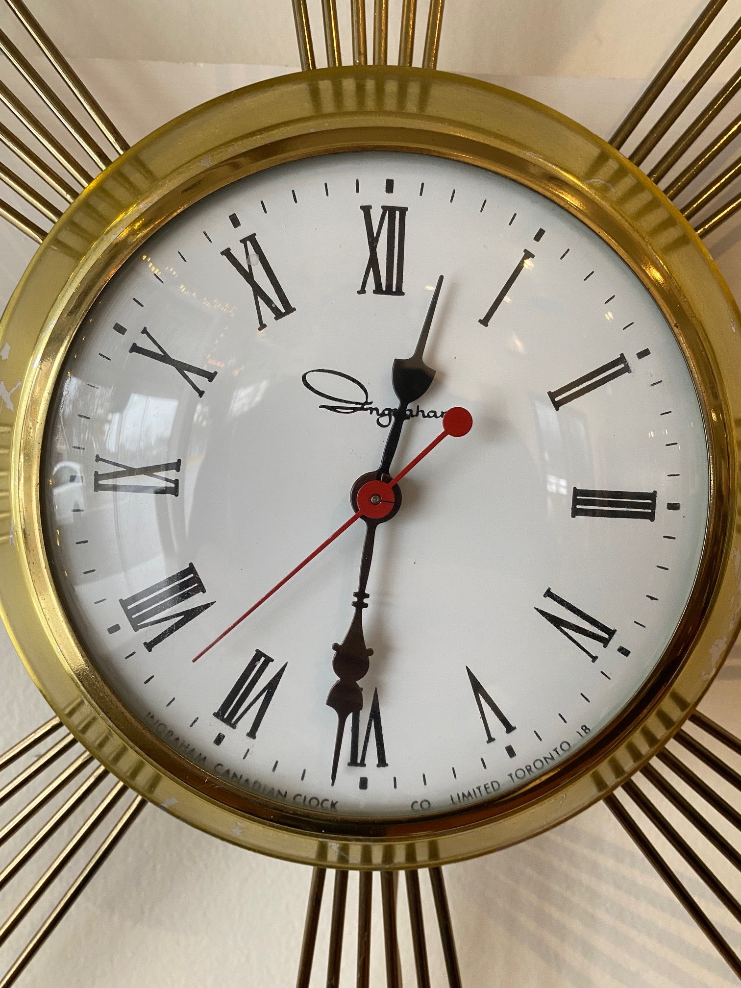 close up of face of Ingram Brass Starburst Electric Clock- Cook Street Vintage